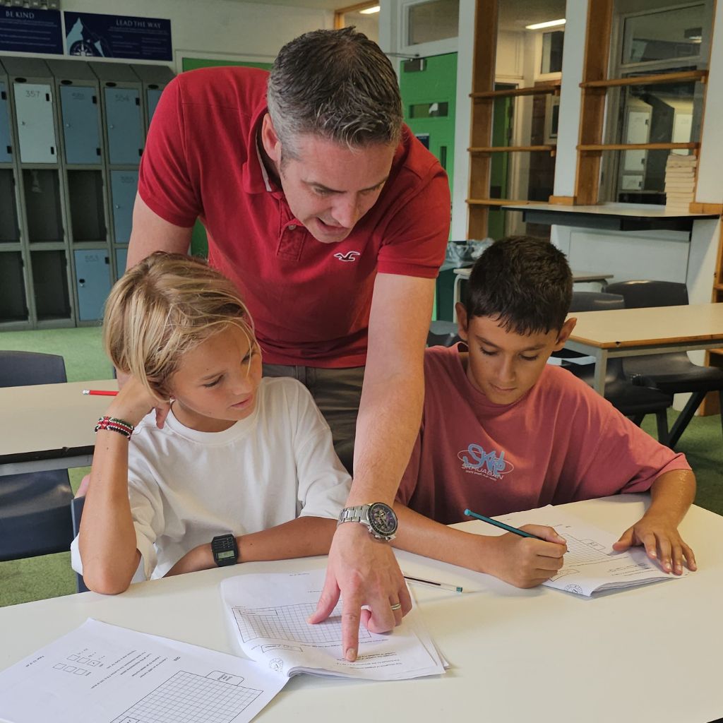 Students at Elite School Tutors 7+ and 11+ exam preparation camp working on practice papers